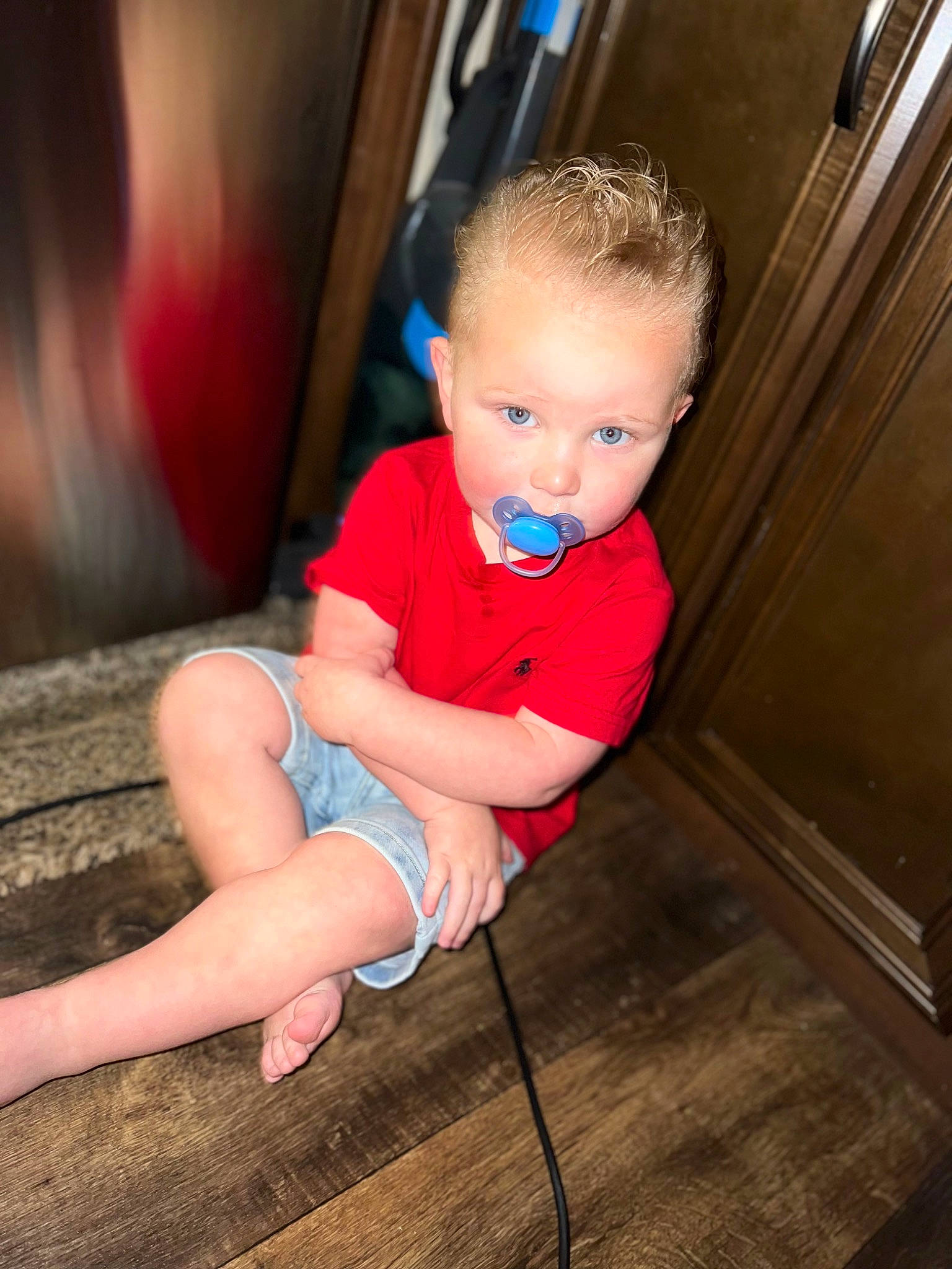 Josiah is registered to the contest to win money with this photo: baby_toddler_clothing, cheek, chin, elbow, eye, flash_photography, floor, flooring, hardwood, iris, knee, leg, mouth, neck, person, shorts, shoulder, skin, standing, thigh