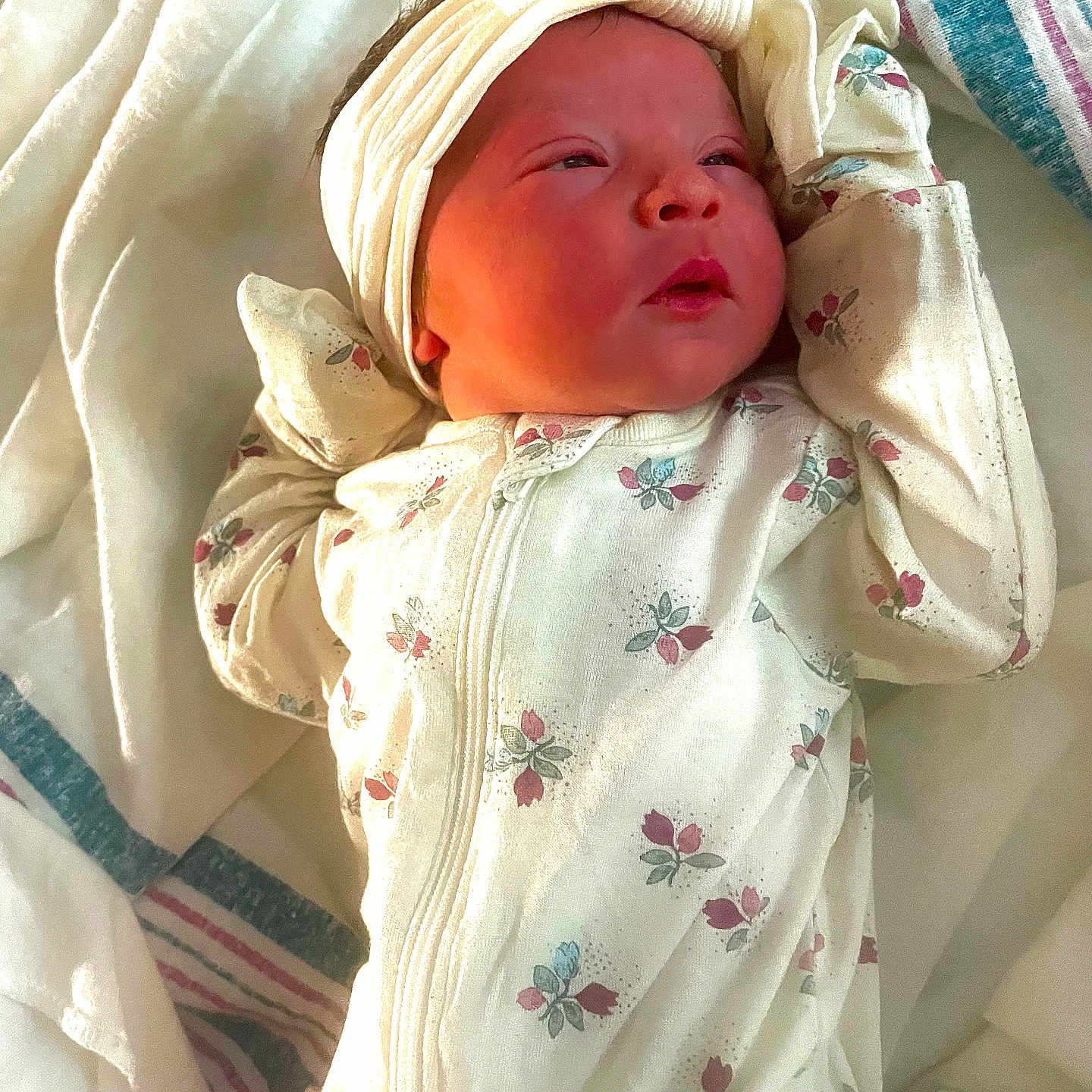 Esmarae joined the competition — help win amazing prizes! baby, blanket, child, clothing, cute, expression, face, floral_pattern, headband, indoors, infant, lying_down, newborn, peaceful, portrait, skin, sleepwear, sleepy, small_hands, soft_fabric