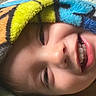 blanket, child, closeup, colorful, comfort, cozy, expression, eyelashes, face, fuzzy, happy, head, joyful, mouth, nose, portrait, skin, smile, teeth, warm