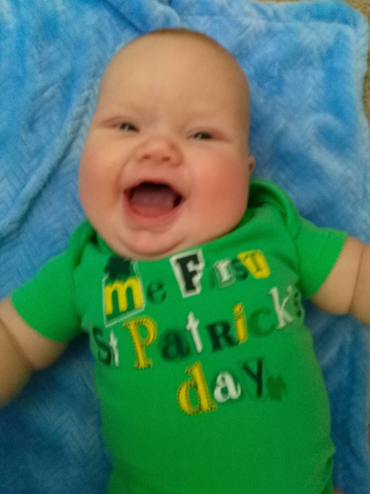 Clark is registered to the contest to win money with this photo: baby, baby_making_funny_faces, baby_toddler_clothing, cheek, child, chin, cool, face, facial_expression, fun, green, head, laugh, lip, mouth, nose, person, product, skin, smile