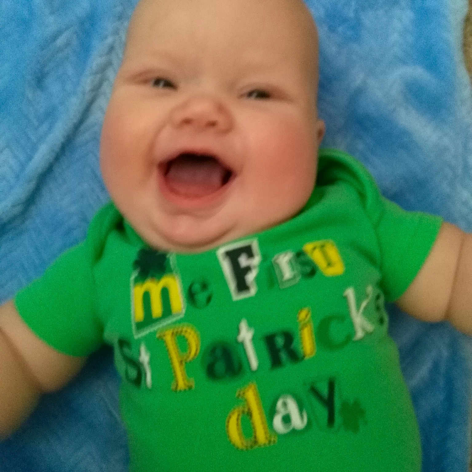Clark is registered to the contest to win money with this photo: baby, baby_making_funny_faces, baby_toddler_clothing, cheek, child, chin, cool, face, facial_expression, fun, green, head, laugh, lip, mouth, nose, person, product, skin, smile