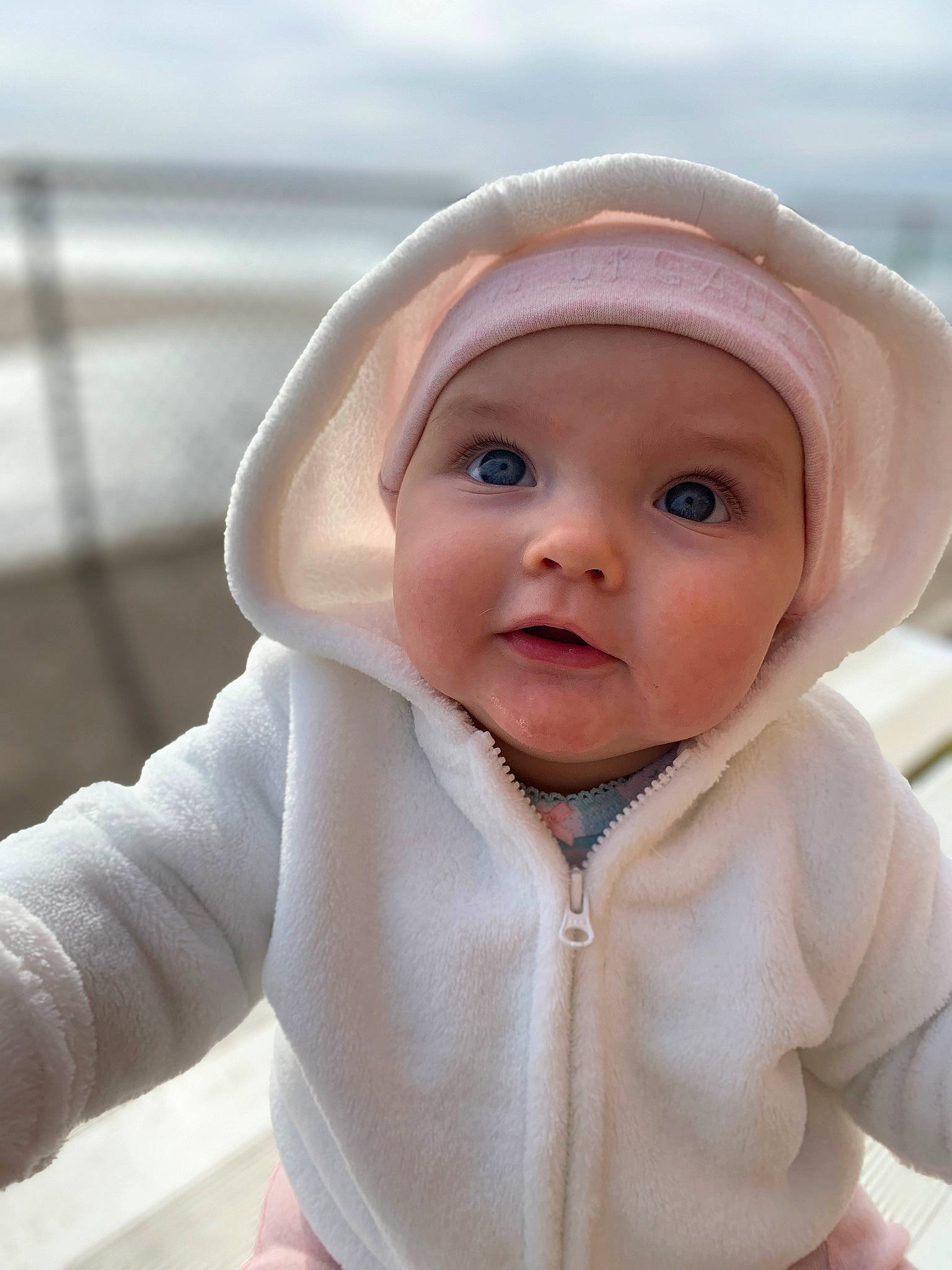 Tatum joined the competition — help win amazing prizes! baby, baby_toddler_clothing, cap, cheek, collar, comfort, eyebrow, face, fashion_accessory, fun, happy, head, headgear, headwear, hood, lip, nose, outerwear, person, skin