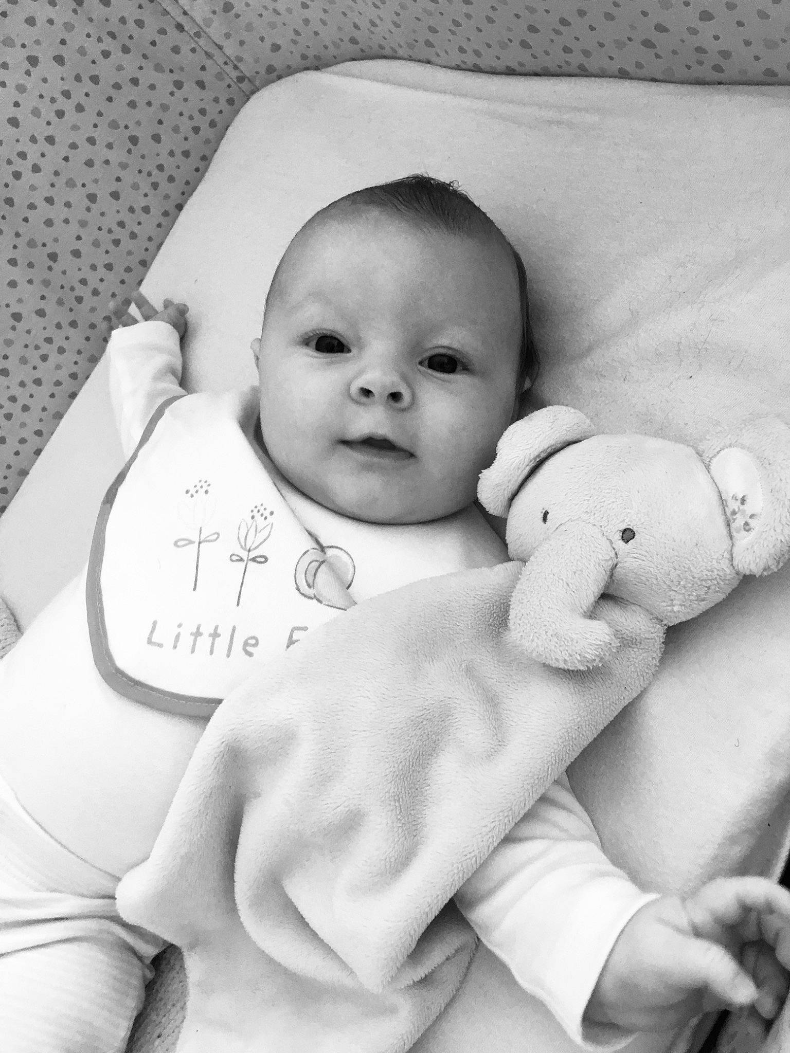 Darcie is registered to the contest to win money with this photo: baby, baby_products, baby_safety, baby_sleeping, baby_toddler_clothing, bedtime, black_and_white, child, person, photography, product, style, toddler, white