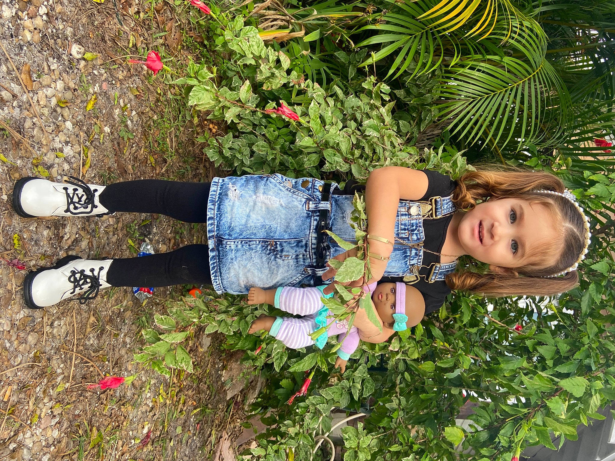 Estrella joined the competition — help win amazing prizes! denim, flower, garden, grass, groundcover, happy, herb, human_leg, knee, leisure, pattern, people_in_nature, person, plant, shrub, sitting, smile, thigh, toddler, tree