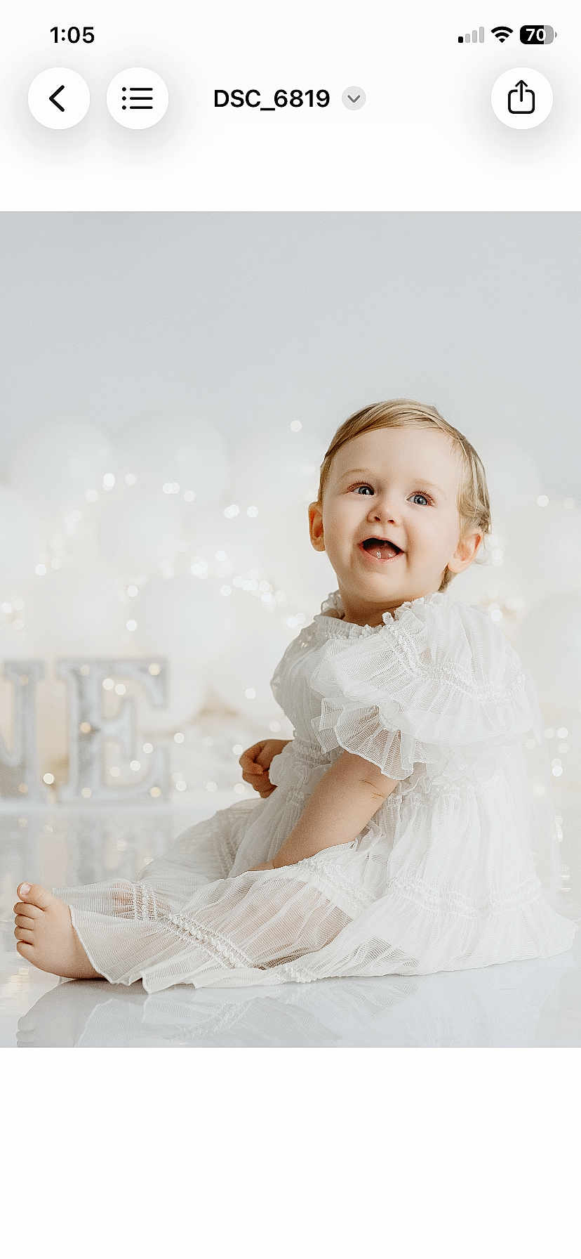 Matilda joined the competition — help win amazing prizes! baby, child, white_dress, smiling, sitting, balloons, fairy_lights, reflection, portrait, happy, cute, celebration, indoors, soft_lighting, blond_hair, blue_eyes, infant, decor, elegant_clothing, festive