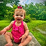Ellieanna joined the competition — help win amazing prizes! baby, child, smiling, pink_clothing, bow, outdoor, greenery, river, grass, trees, happy, sitting, cute, nature, summer, portrait, person, skin, barefoot, infant