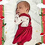 baby, newborn, sleeping, red_dress, white_blanket, christmas_frame, holiday, festive, cute, infant, holly, candy_cane, santa_hat, reindeer, sleigh, snow_effect, cozy, portrait, child, peaceful