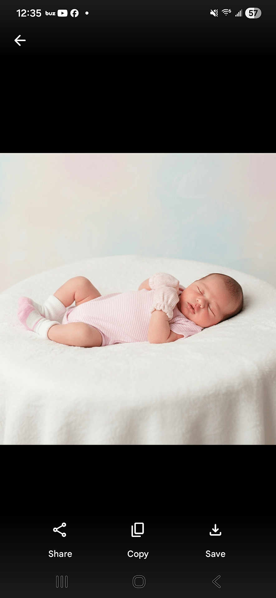 Vicky is registered to the contest to win money with this photo: baby, newborn, sleeping, infant, pink_clothing, white_blanket, soft_texture, peaceful, cute, resting, child, portrait, indoors, cozy, small, human, adorable, peace, relaxed, lying_down