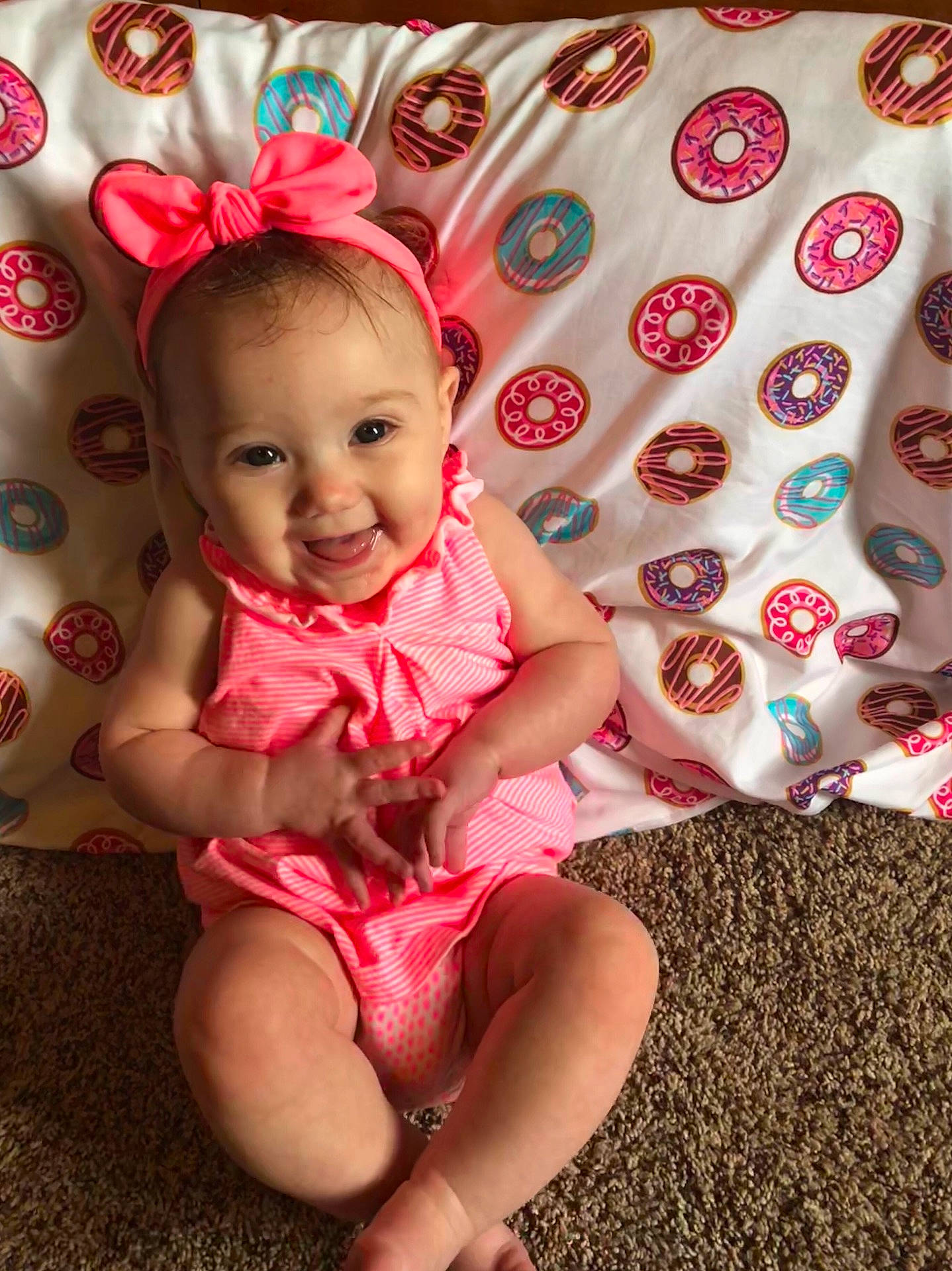 Adilyn is registered to the contest to win money with this photo: child, girl, hair_accessory, infant, joy, person, pink, product, skin, smile, textile, toddler