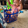 Liberty joined the competition — help win amazing prizes! toddler, child, blue_basket, toys, carpet, indoor, happy, smiling, arms_up, curly_hair, pink_shirt, plastic_basket, playtime, living_room, furniture, green_chair, colorful, baby_toy, floor, fun