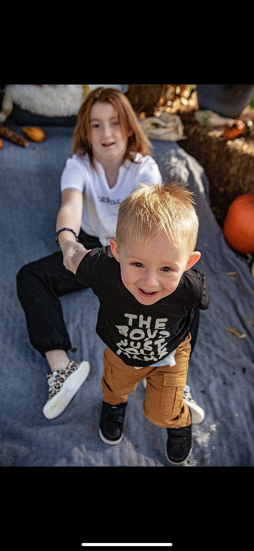 Kylee joined the competition — help win amazing prizes! calabaza, clothing, cucurbita, face, facial_expression, fun, grass, hairstyle, happy, head, joy, leaf, leg, leisure, orange, person, pumpkin, shoe, smile, sneakers