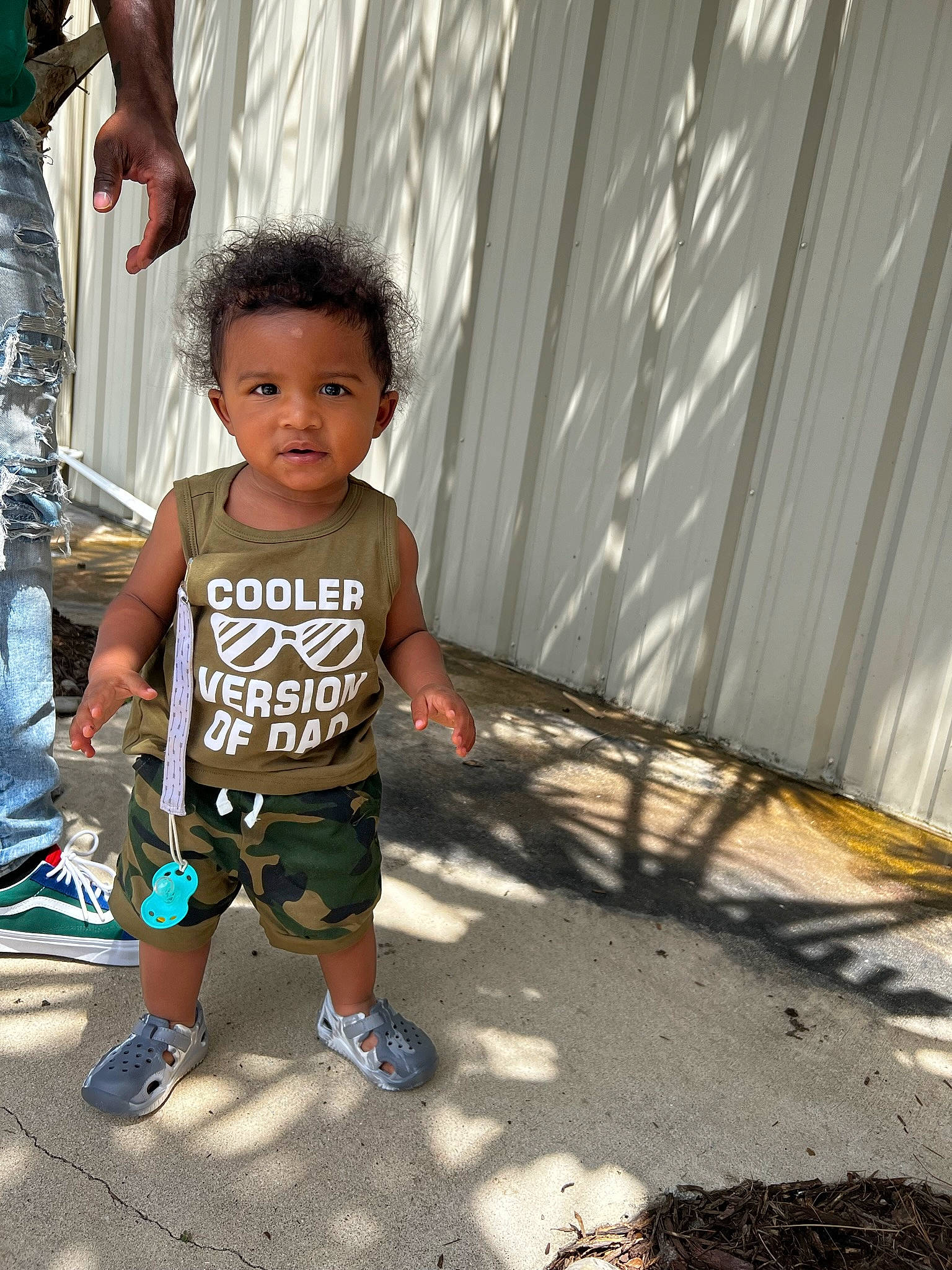 Cairo is registered to the contest to win money with this photo: child, flip_flops, foot, fun, grass, happy, human_leg, leg, leisure, person, recreation, sandal, shadow, shoe, shorts, slipper, sneakers, t_shirt, thigh, toddler