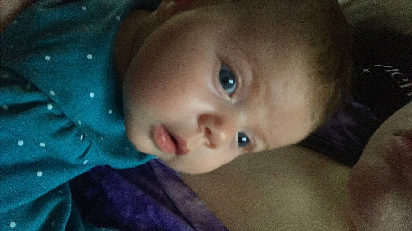 Jupiter is registered to the contest to win money with this photo: baby, black_hair, cheek, dress, ear, eye, eyebrow, eyelash, flash_photography, forehead, happy, human_body, iris, lip, mouth, nose, person, plant, skin, smile