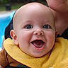 baby, child, smiling, face, blue_eyes, yellow_bib, happy, person, portrait, outdoor, pool, water, adult, holding, closeup, skin, head, clothing, fun, daylight