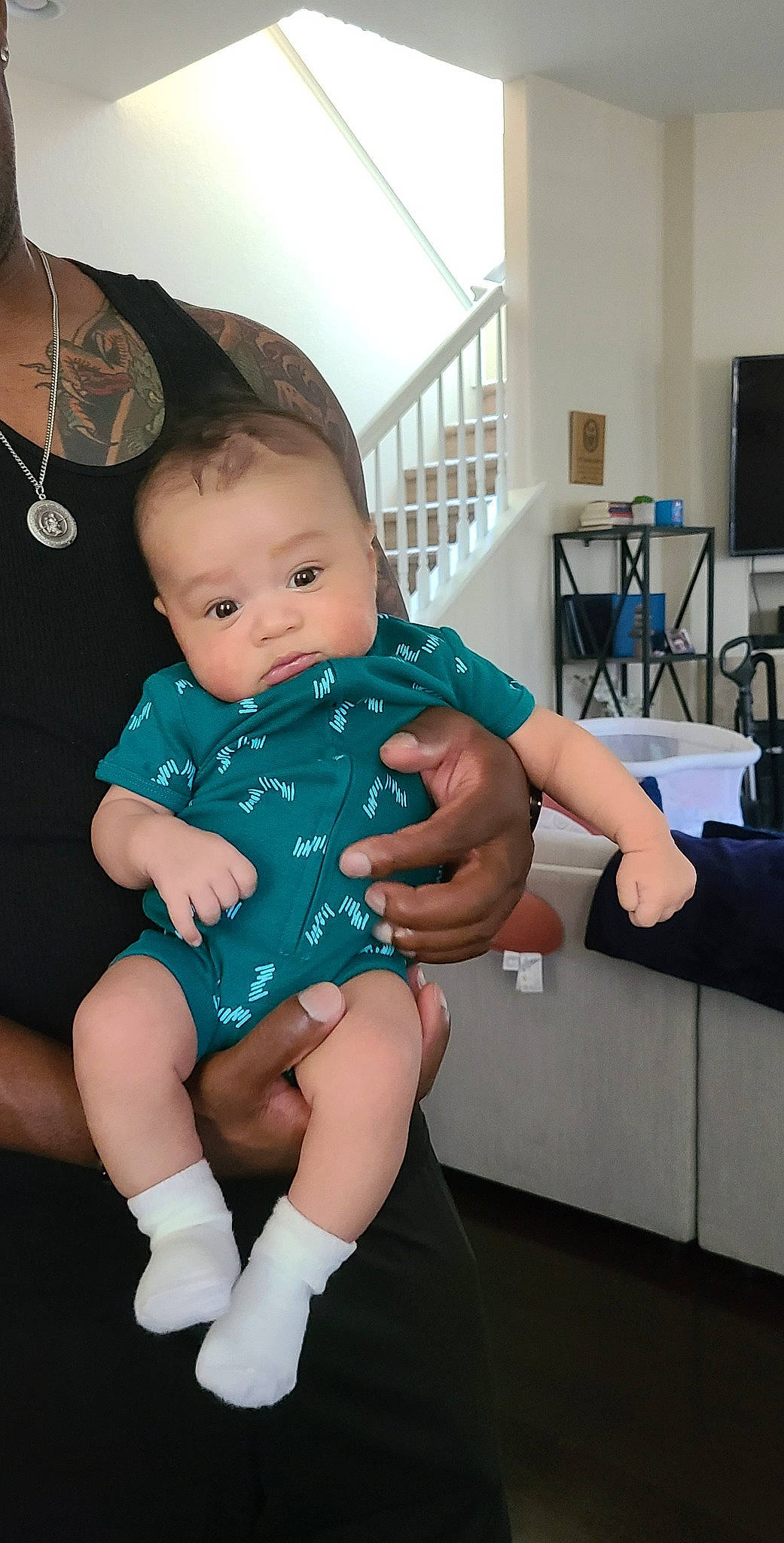 Dante is registered to the contest to win money with this photo: arm, azure, baby, baby_toddler_clothing, comfort, dress, finger, happy, iris, joint, knee, lap, leg, person, shoulder, skin, standing, television, thigh, toddler