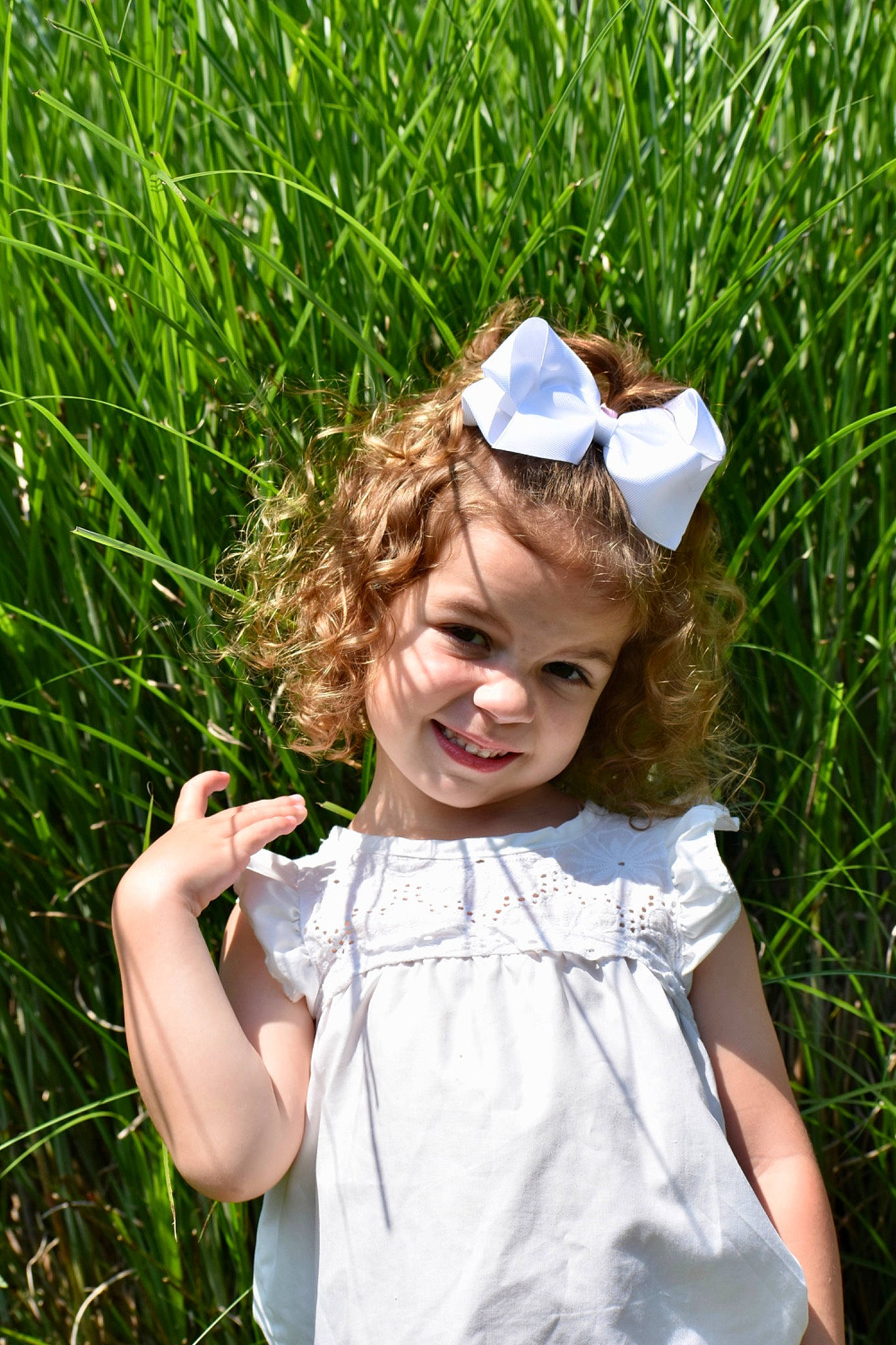 Allie is registered to the contest to win money with this photo: child, gesture, grass, green, hair, hairstyle, hand, happy, hat, head, joy, leaf, nature, people_in_nature, person, plant, skin, summer, sunglasses, sunlight