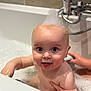 baby, child, bath, bathtub, bubbles, foam, water, skin, hand, smile, happy, cute, indoor, person, head, face, eyes, fun, play, parent