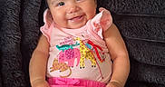 Eściensia joined the competition — help win amazing prizes! apparel, baby, blanket, casual, child, cute, face, happy, indoors, infant, one_person, person, pink_clothing, plush, portrait, sitting, skin, smiling, soft_texture, young_child