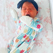 Blaire joined the competition — help win amazing prizes! baby, sleeping, yawning, headband, onesie, floral_pattern, infant, cute, bed, blanket, soft, newborn, child, sleepwear, hand, mouth, face, lying_down, pastel_colors, cozy