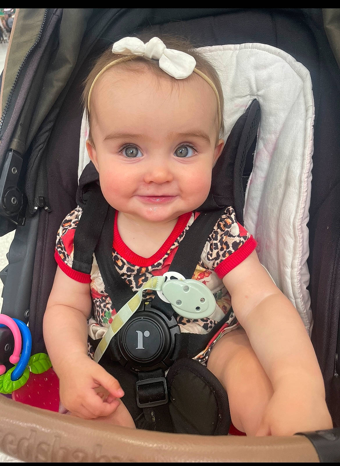 Lilah joined the competition — help win amazing prizes! baby, baby_carriage, baby_products, baby_safety, baby_toddler_clothing, carmine, cheek, child, cool, fashion_accessory, flash_photography, fun, happy, iris, person, sitting, skin, sleeve, smile, t_shirt