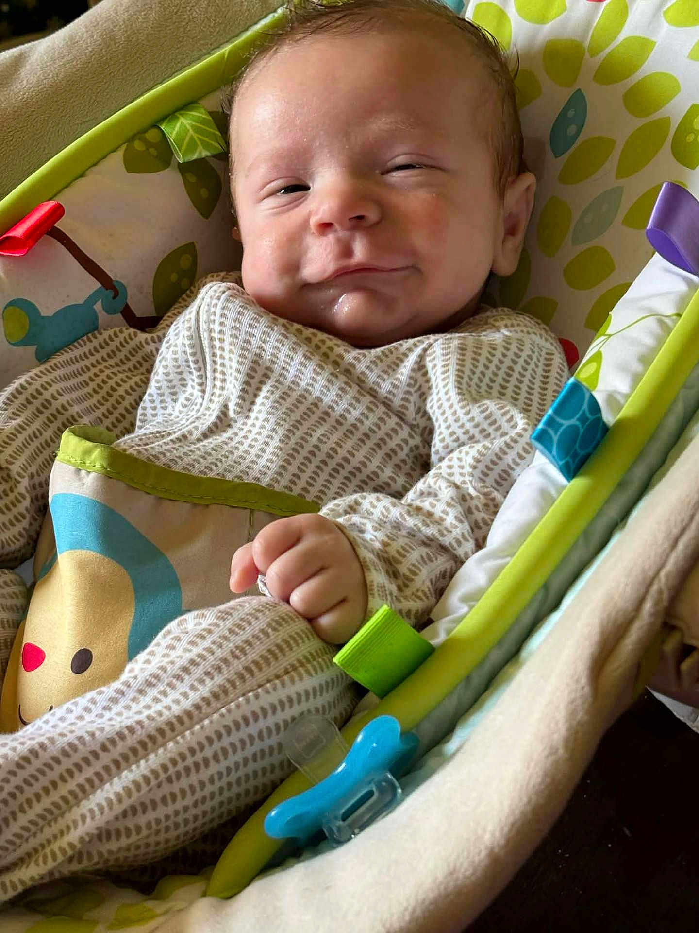 Maverick joined the competition — help win amazing prizes! baby, infant, smile, face, hand, clothing, pattern, baby_seat, toy, pacifier, cushion, colorful, comfort, indoor, portrait, child, young, cute, resting, expression