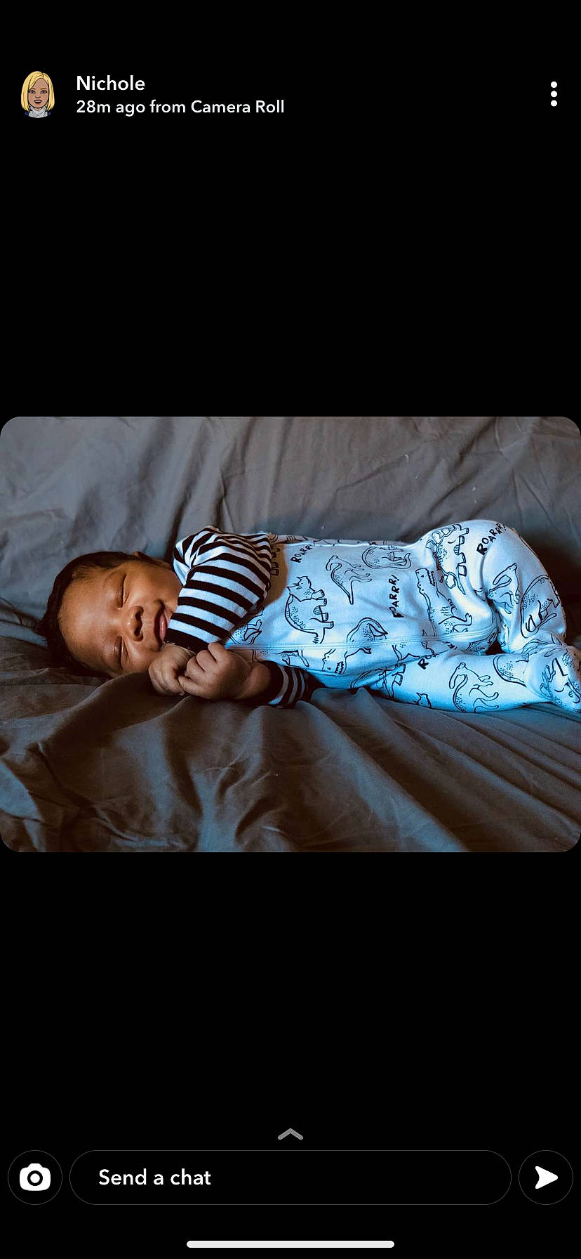 Parker is registered to the contest to win money with this photo: baby, baby_toddler_clothing, bedding, child, comfort, darkness, flash_photography, flesh, happy, linens, magenta, pattern, person, portrait_photography, product, room, sitting, sleeve, t_shirt, toddler