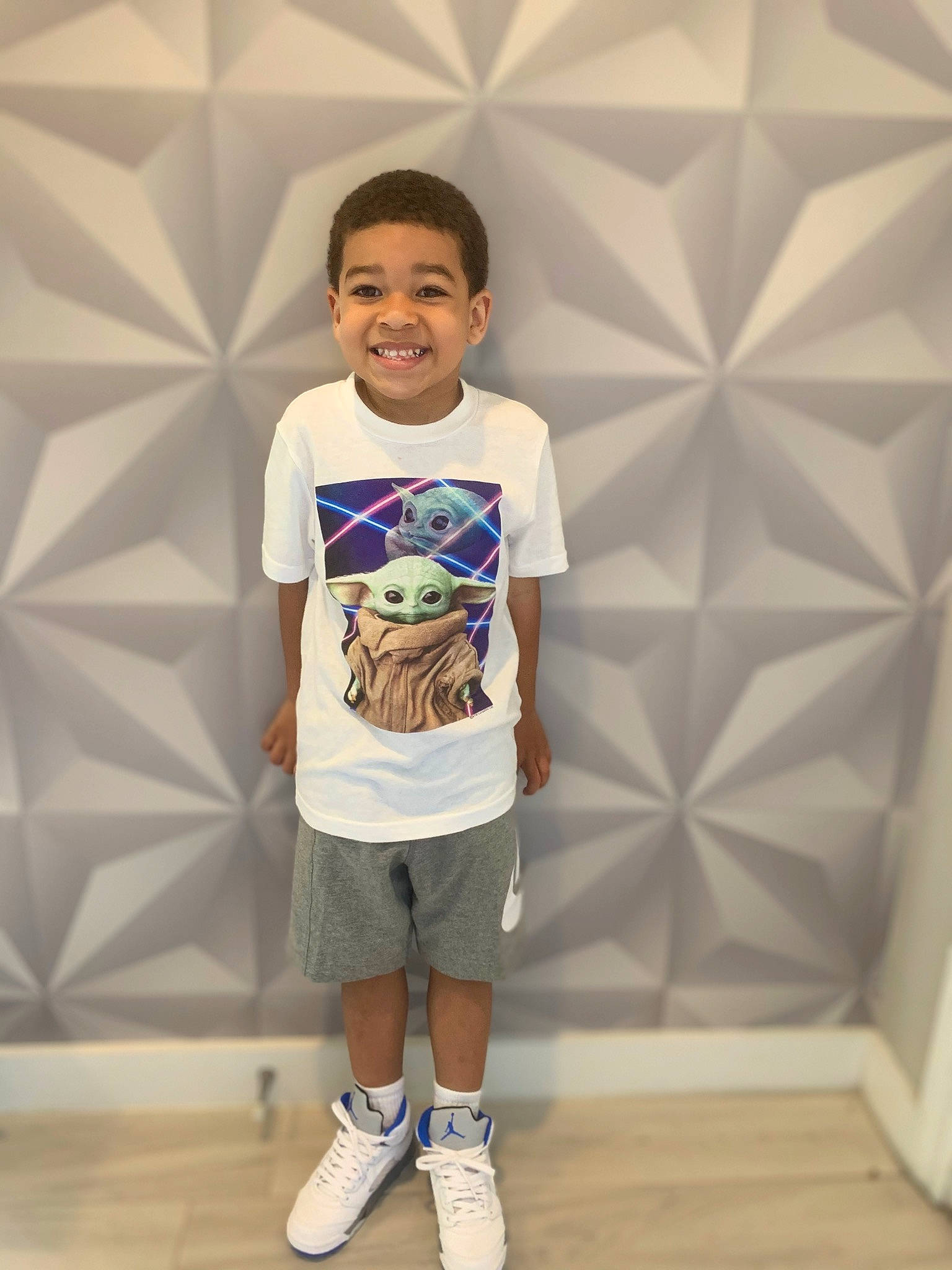 Jayceon is registered to the contest to win money with this photo: active_shorts, bermuda_shorts, board_short, child, chin, cool, electric_blue, fashion_design, flooring, fun, hairstyle, happy, human_body, joint, joy, person, shorts, shoulder, sleeve, smile