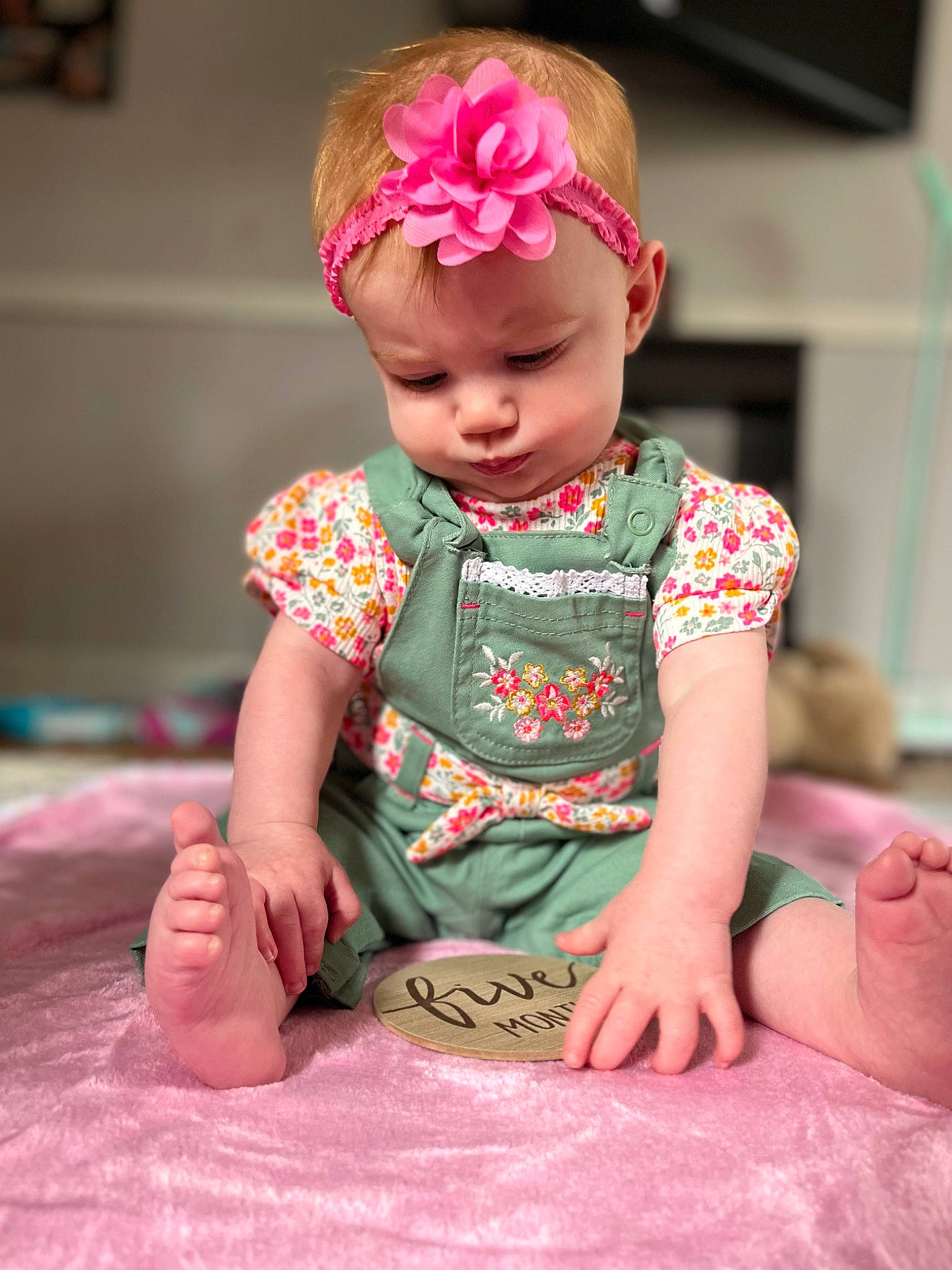 Bryleigh is registered to the contest to win money with this photo: arm, baby, baby_toddler_clothing, beauty, cheek, chin, dress, flower, happy, headband, headpiece, headwear, lip, magenta, neck, pattern, peach, person, pink, skin