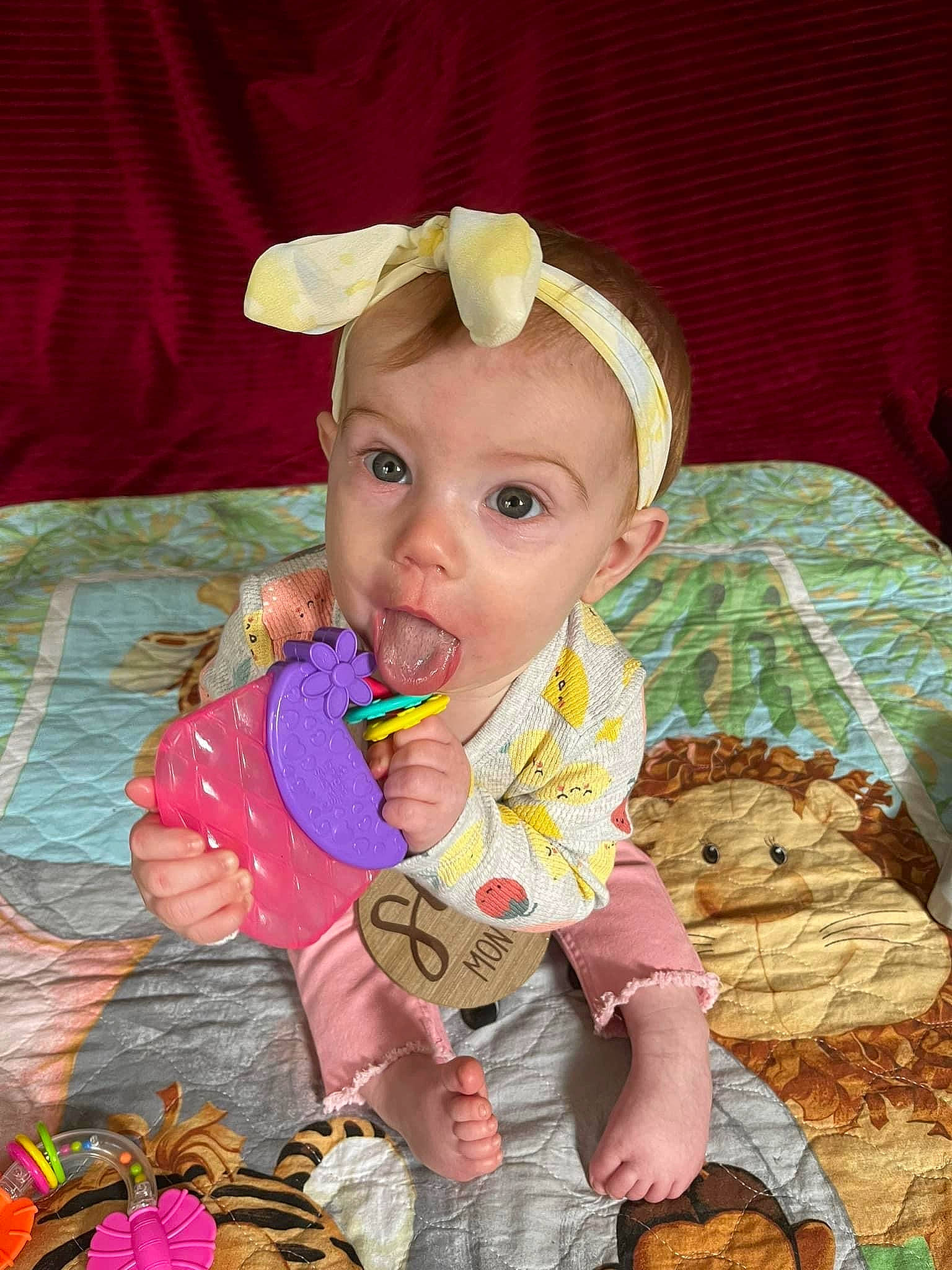 Bryleigh is registered to the contest to win money with this photo: baby, baby_products, baby_toddler_clothing, baby_toys, cheek, child, eye, face, fun, happy, head, iris, linens, pattern, person, pink, play, room, sitting, skin