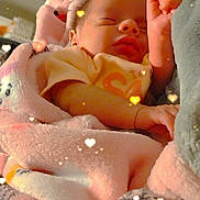 Azrael is registered to the contest to win money with this photo: baby, newborn, sleeping, blanket, pink, soft, cozy, infant, closeup, face, hand, cute, indoors, warm, resting, peaceful, child, person, comfort, portrait