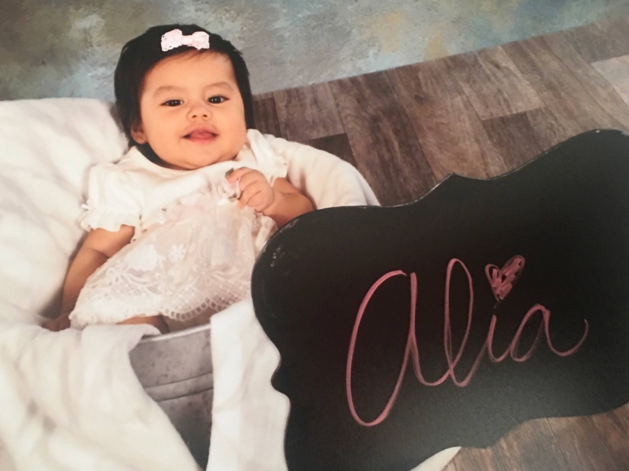 Alia Marie is registered to the contest to win money with this photo: baby, beauty, cheek, child, cloud, cool, hair_accessory, hand, happy, head, headgear, headpiece, human, people, person, photography, pink, product, skin, smile