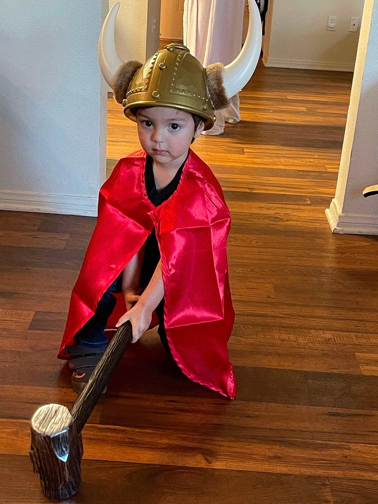 Aldo is registered to the contest to win money with this photo: boot, carmine, costume, costume_design, costume_hat, event, fashion_accessory, fashion_design, fictional_character, floor, flooring, hardwood, hat, headwear, helmet, jewellery, person, personal_protective_equipment, uniform, varnish