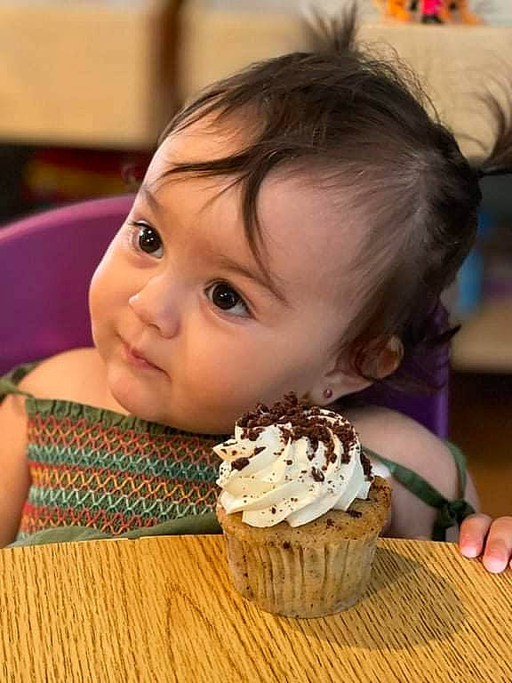 Ellie is registered to the contest to win money with this photo: baked_goods, baking, buttercream, cake, cake_decorating, cheek, child, cream, cuisine, dessert, dish, eyelash, food, happy, ingredient, person, plate, recipe, sweetness, tableware