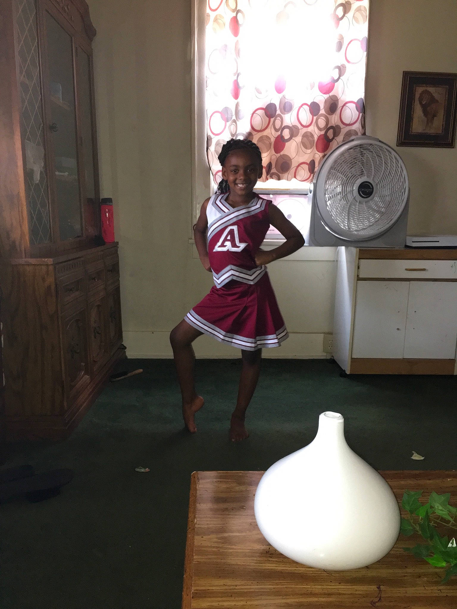 Jada is registered to the contest to win money with this photo: balance, floor, interior_design, joy, lampshade, leg, light, lighting_accessory, person, room, standing