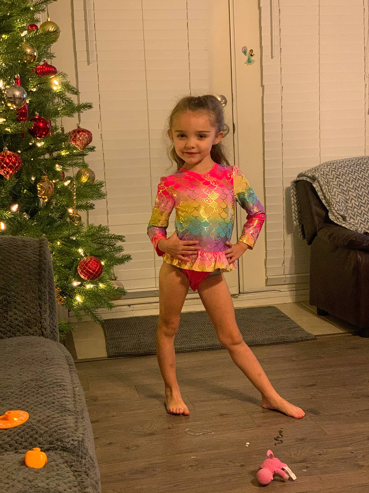 Presleigh joined the competition — help win amazing prizes! barefoot, beauty, child, christmas_tree, flooring, fun, hairstyle, happy, holiday_ornament, human_body, human_leg, joy, leg, ornament, person, pink, shoulder, smile, standing, thigh