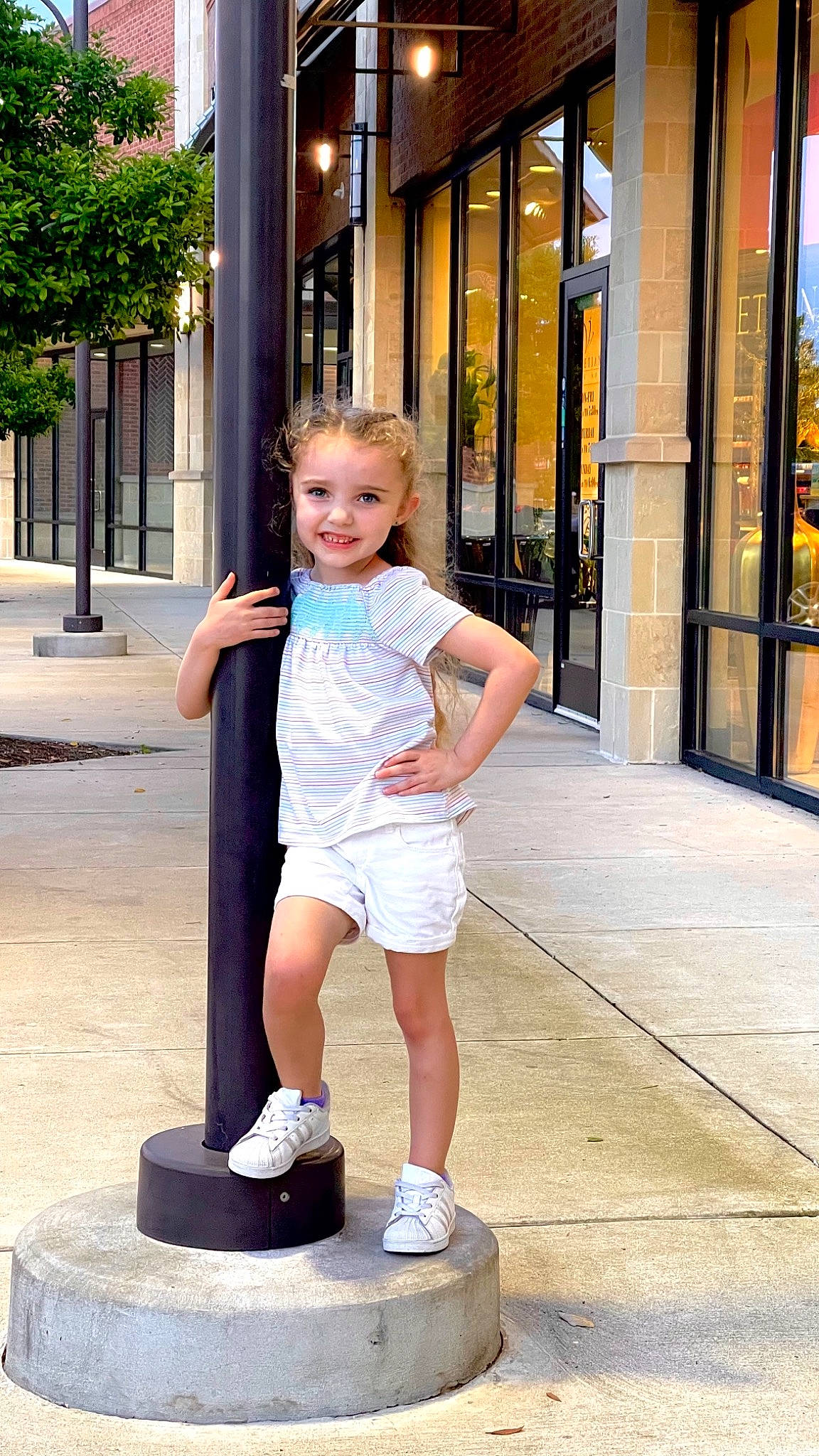 Presleigh is registered to the contest to win money with this photo: chin, fun, hair, hand, happy, joy, knee, leg, leisure, person, recreation, shorts, shoulder, sidewalk, smile, standing, street_fashion, summer, t_shirt, thigh