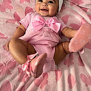 Miracle joined the competition — help win amazing prizes! apparel, baby, blanket, bow, butterfly_pattern, child, cute, footwear, happy, headband, indoors, infant, legs, lying_down, pink, portrait, skin, smiling, soft_texture, toddler