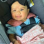 Hennessey is registered to the contest to win money with this photo: baby, blanket, bow, car_seat, child, clothing, comfort, cute, floral, happy, headband, indoors, infant, person, pink, portrait, safety, seat, smiling, straps