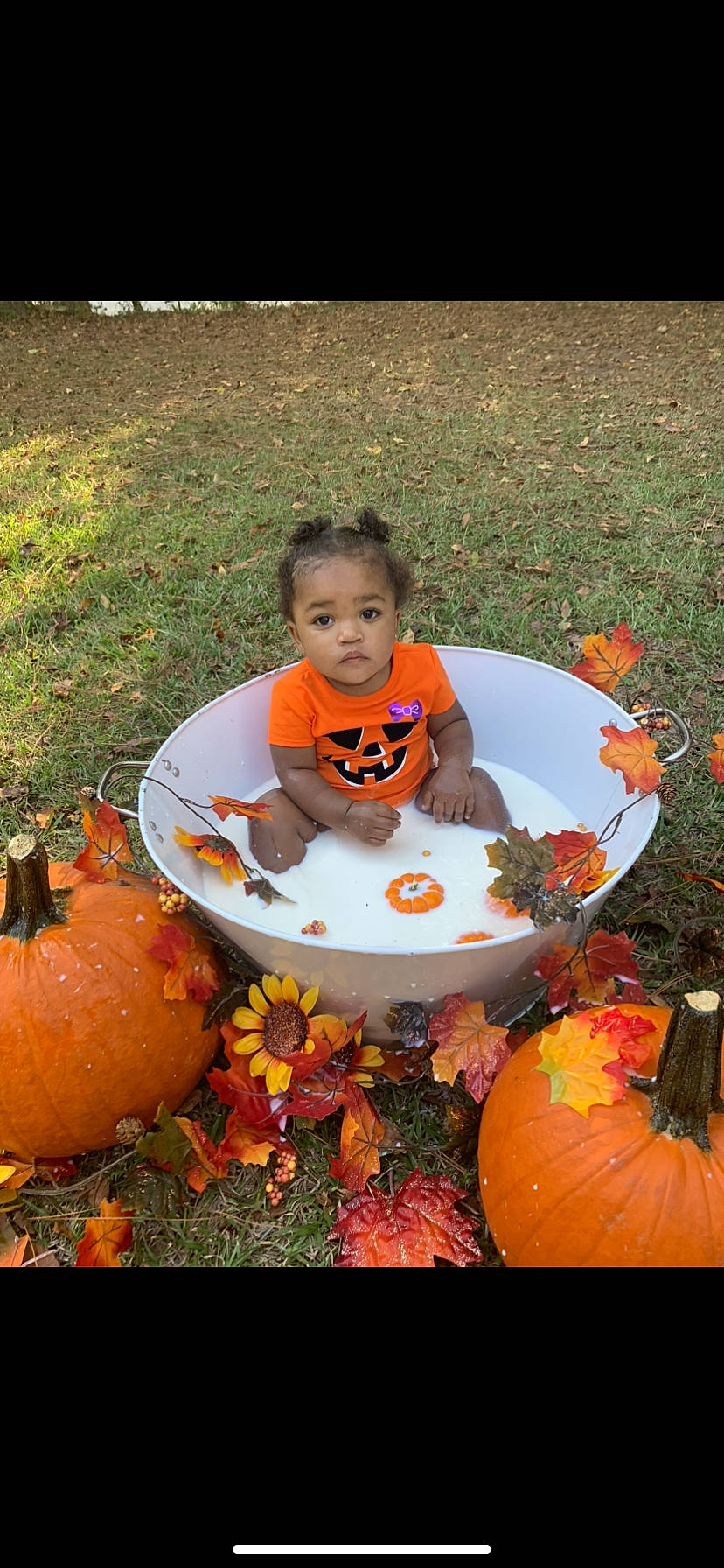Kiyah is registered to the contest to win money with this photo: _and_melon_family, _gourd, calabaza, cucumber, cucurbita, facial_expression, fruit, gourd, grass, happy, local_food, natural_foods, orange, person, plant, produce, pumpkin, squash, t_shirt, toddler