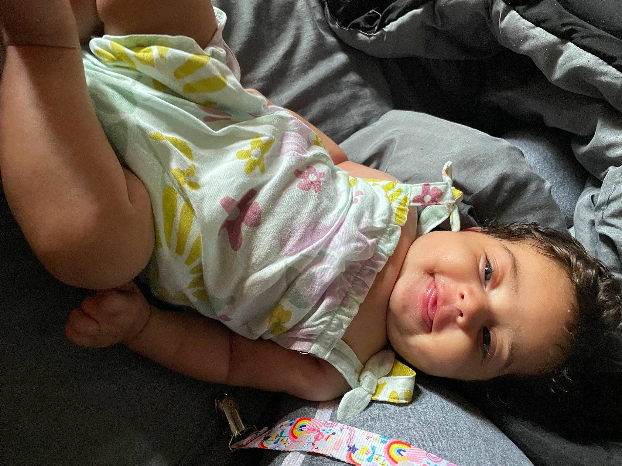 Londyn is registered to the contest to win money with this photo: baby, baby_products, cheek, child, comfort, couch, fun, grass, happy, human_leg, nap, person, plant, sitting, skin, sleep, thigh, toddler, tree, vacation