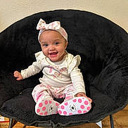 Ivory joined the competition — help win amazing prizes! baby, child, smiling, headband, bow, sitting, chair, black_chair, long_sleeve, patterned_pants, pink, white, shoes, polka_dots, floor, wood_floor, indoor, happy, cute, portrait