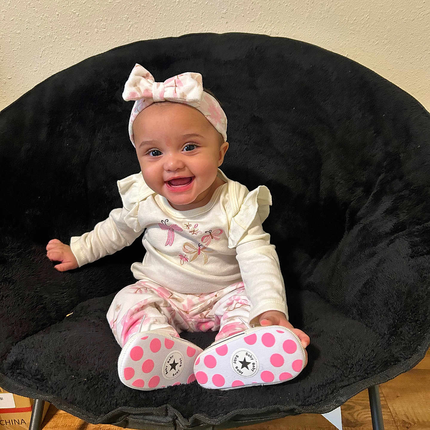Ivory joined the competition — help win amazing prizes! baby, black_chair, bow, chair, child, cute, floor, happy, headband, indoor, long_sleeve, patterned_pants, pink, polka_dots, portrait, shoes, sitting, smiling, white, wood_floor