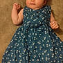 baby, infant, child, dress, blue_dress, cherry_pattern, lying_down, bed, pillow, barefoot, cute, curious, soft_lighting, indoors, skin, face, hand, foot, person, portrait