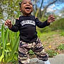 Sevyn is registered to the contest to win money with this photo: bodypart, boy, child, clothing, face, finger, footwear, grass, hand, happy, head, jeans, male, pants, person, photography, plant, portrait, shoe, shorts