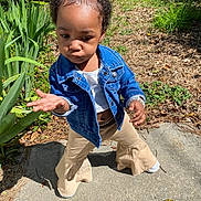 Sevyn is registered to the contest to win money with this photo: baby, city, clothing, coat, face, grass, head, jacket, jeans, pants, person, photography, plant, portrait, pottedplant, road, soil, street, urban, walking