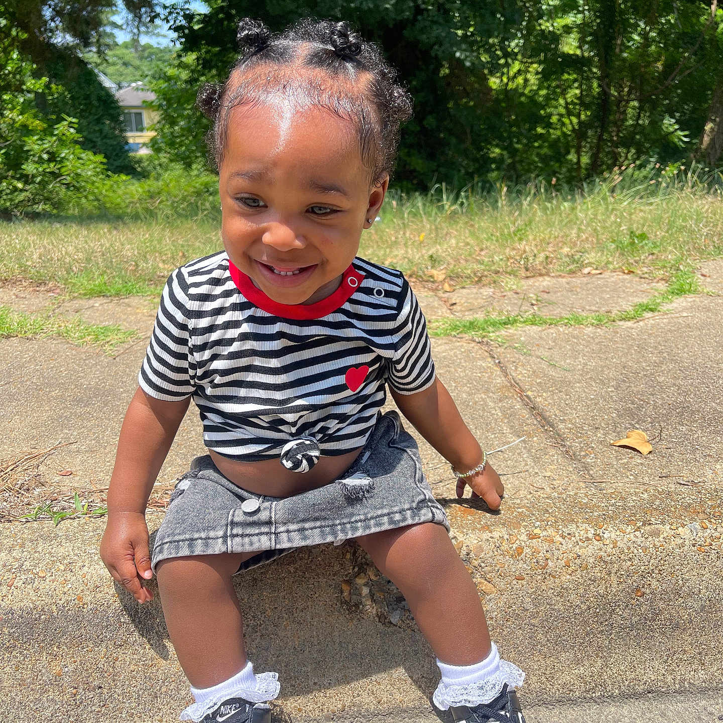 Sevyn joined the competition — help win amazing prizes! child, clothing, face, female, footwear, girl, grass, head, nature, outdoors, park, person, photography, plant, portrait, shoe, shorts, sitting, sneaker, tree