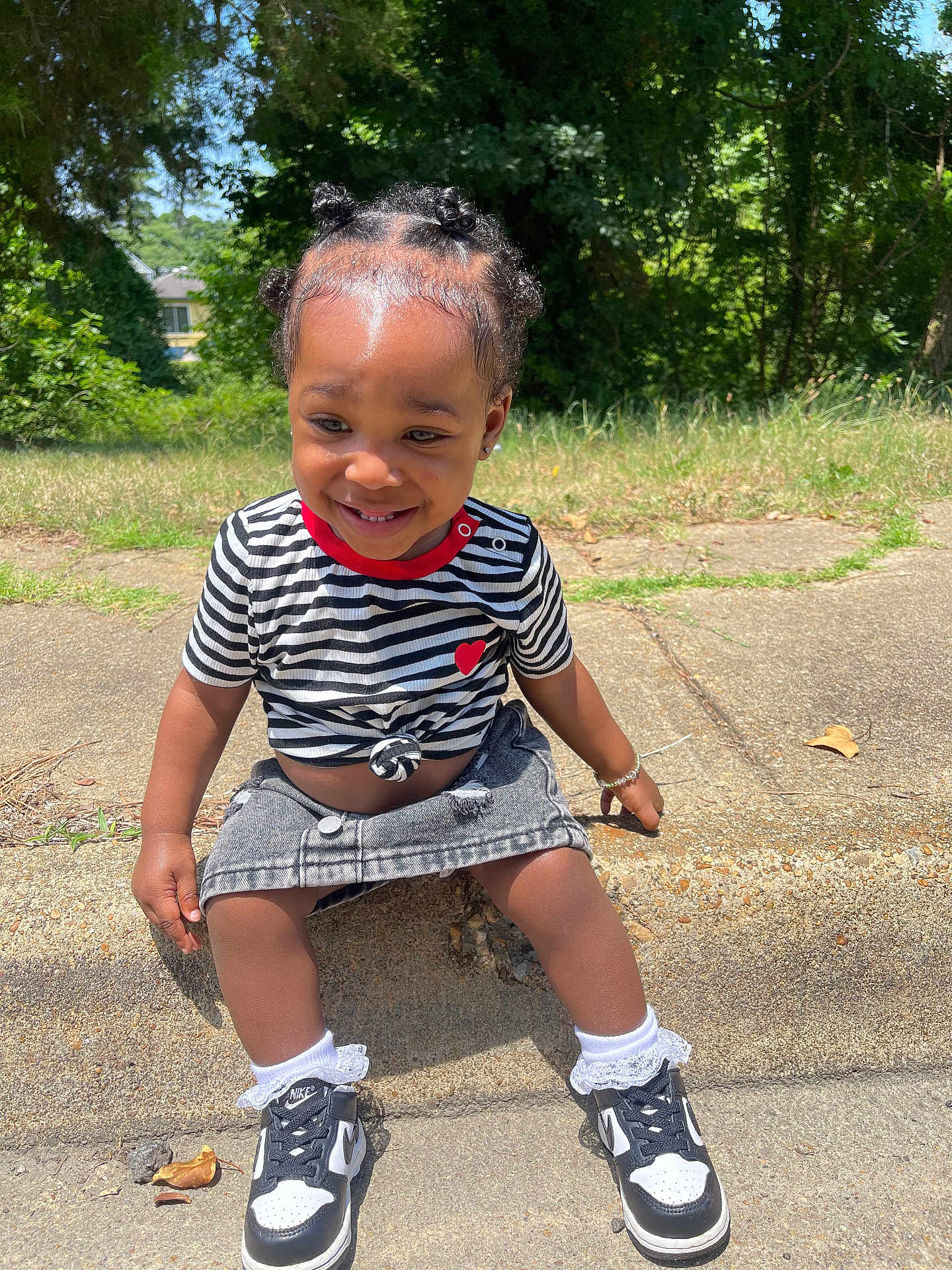 Sevyn joined the competition — help win amazing prizes! child, clothing, face, female, footwear, girl, grass, head, nature, outdoors, park, person, photography, plant, portrait, shoe, shorts, sitting, sneaker, tree