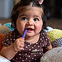baby, brown_clothing, child, cushion, cute, face, foot, hand, happy, indoors, infant, pigtails, playful, polka_dot, portrait, purple, sitting, smiling, toddler, toy