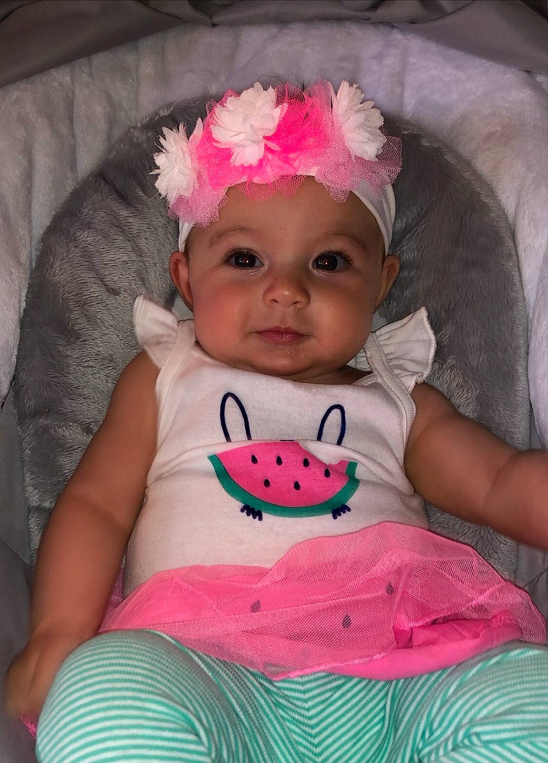 Madison is registered to the contest to win money with this photo: baby, baby_products, baby_toddler_clothing, cheek, child, hair_accessory, head, headgear, headwear, lip, person, pink, product, skin, textile, toddler