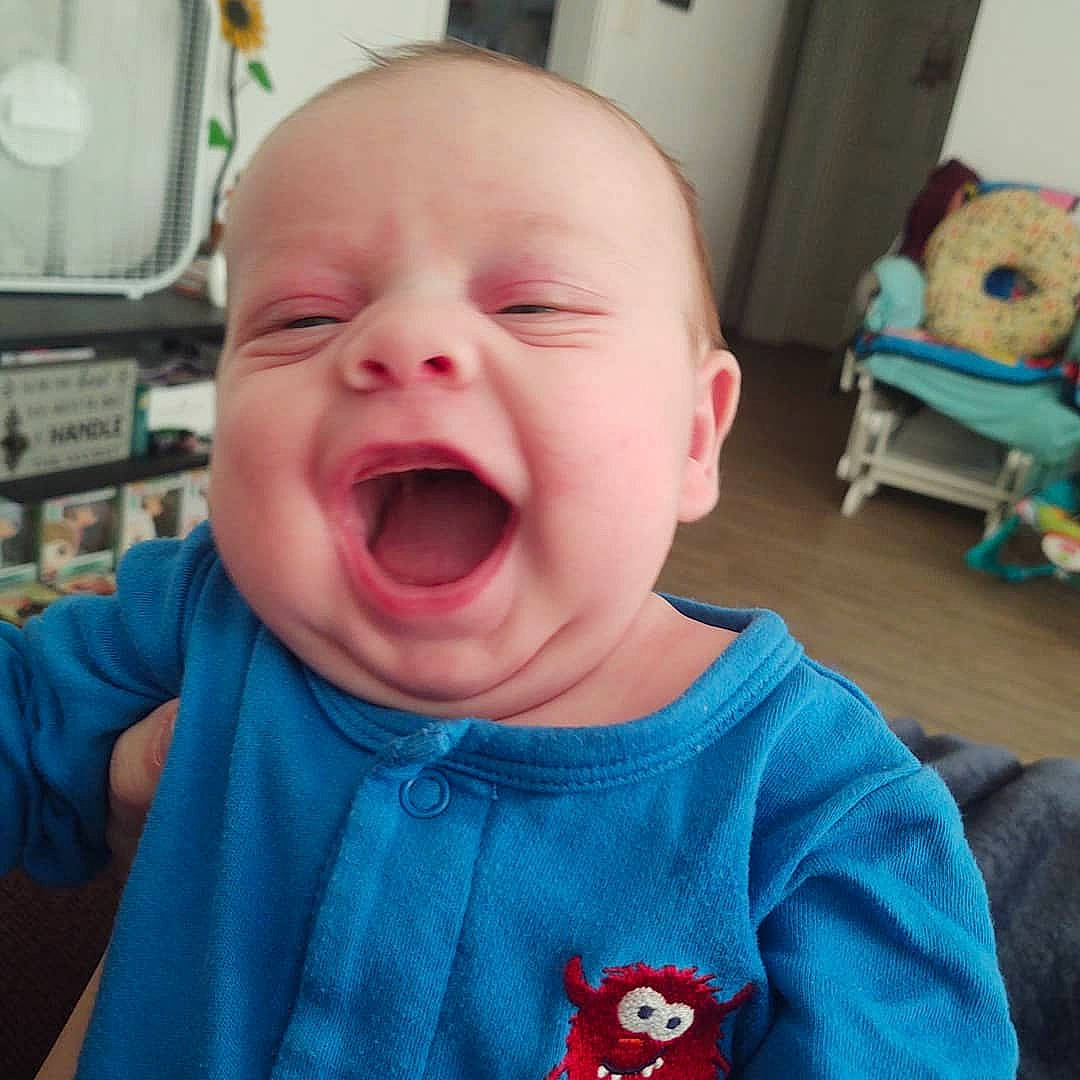 Emitt is registered to the contest to win money with this photo: baby, baby_making_funny_faces, blue, cheek, child, chin, cool, face, facial_expression, happy, head, laugh, lip, mouth, nose, organ, person, skin, smile, toddler